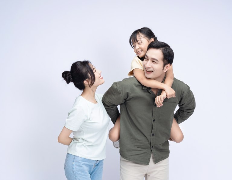 A Parent’s Guide To Navigating Resources For Autism Support In Singapore Happy Asian family bonding together, representing parental support and guidance in navigating autism resources in Singapore.