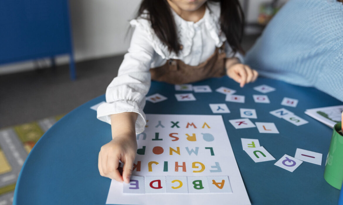 Child engaging in a learning activity with colorful alphabet cards, illustrating early intervention for global developmental delay (GDD).