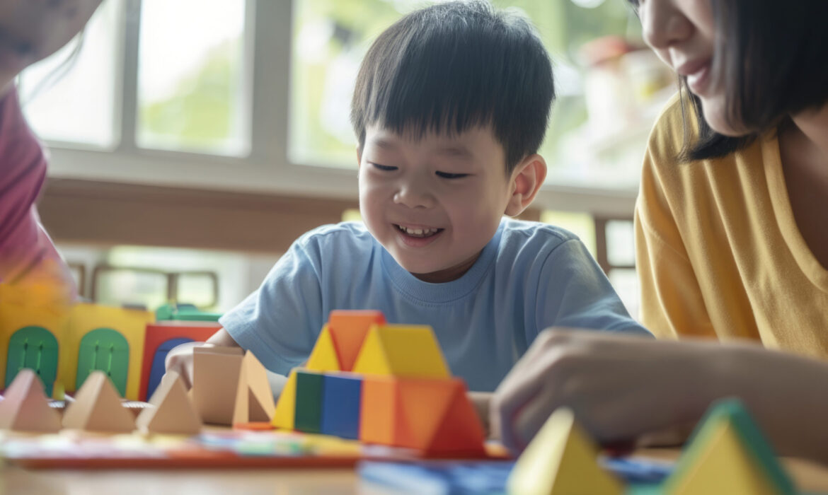 Smiling child engaging in a developmental activity with colorful blocks, illustrating the importance of tracking progress using an autism milestone chart.