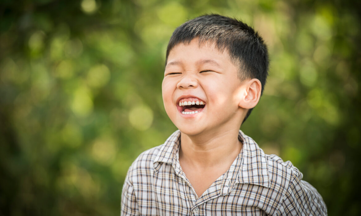 A mother and father sitting on a sofa