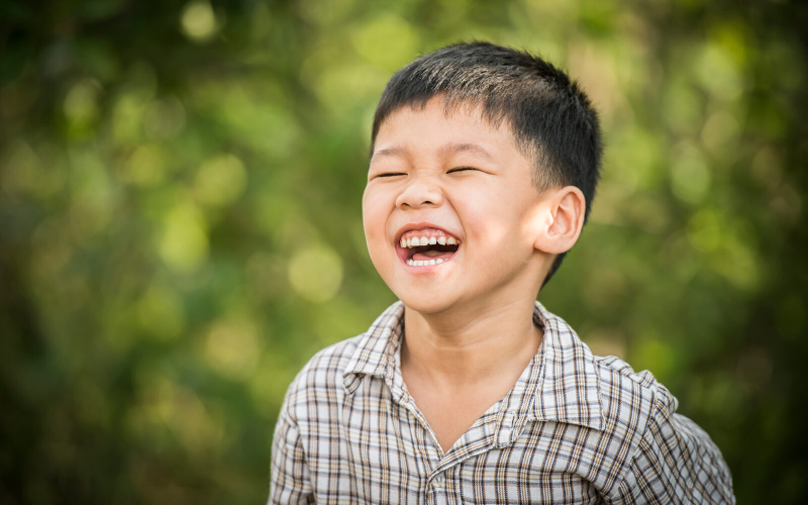A mother and father sitting on a sofa
