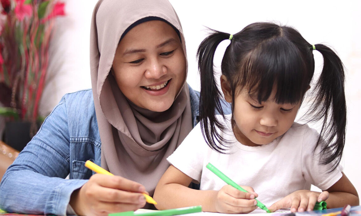 Educator using coloring activities for an autism behavior checklist.