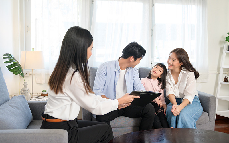 Family receiving professional guidance on autism therapy and management.