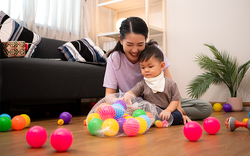 Child engaging in developmental play during an autism therapy session.